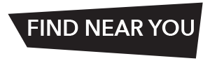 A black, slanted rectangular sign with white, bold capital letters that read FIND NEAR YOU.